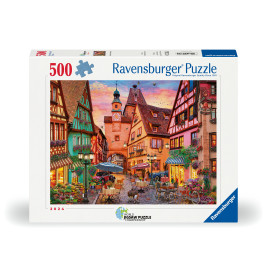Ravensburger Puzzle mit 500 Teilen und bunter Illustration einer europäischen Dorfstraße bei Sonnenuntergang.