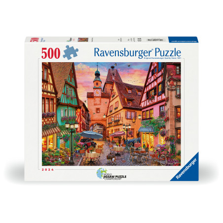 Ravensburger Puzzle mit 500 Teilen und bunter Illustration einer europäischen Dorfstraße bei Sonnenuntergang.