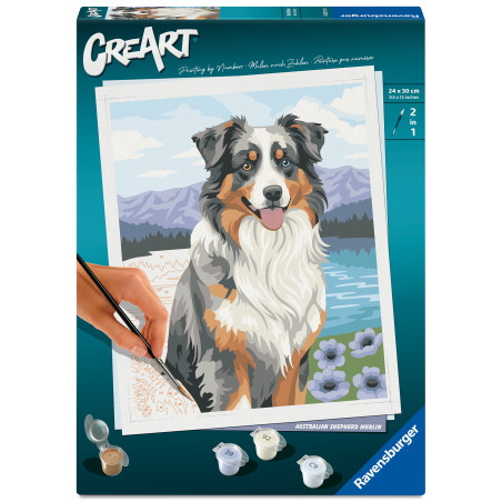 Malset-Box mit Bild eines Australian Shepherds vor Bergen und Blumen im Hintergrund.