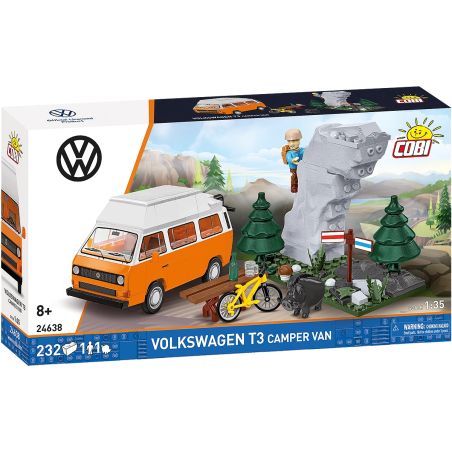 Box eines Volkswagen T3 Camper Van Bausatzes mit Bäumen, Steinen, Fahrrad und Figur auf der Vorderseite.