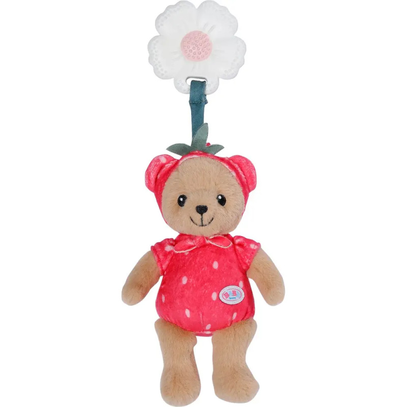 Kuschelteddybär im roten Erdbeer-Outfit hängt an einem weißen, blumenförmigen Clip.