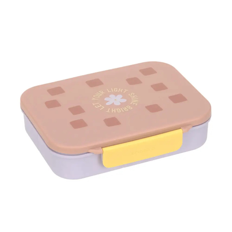 Pastellfarbene Brotdose mit rosa Deckel, gelbem Verschluss und dem Aufdruck "Let your light shine bright" obenauf.