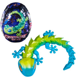 Spielzeug-Gecko in Blau und Grün neben eiförmiger Verpackung mit der Aufschrift CRYSTALYNX GECKO.