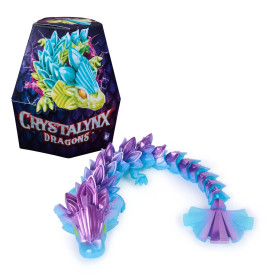 Bunte Crystalynx Dragons Figur mit edelsteinartigem Körper neben passender, sechseckiger Verpackung.