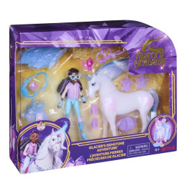 Unicorn Academy Spielset mit Puppe, weißem Einhorn und Zubehör in einer lila-gelben Verpackung.