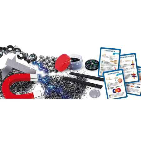 Experimentierkasten mit Hufeisenmagnet, Eisenfeilen, Kompass, Metallkugeln, Karten und Pinzette.