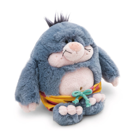 Ein Plüschtier mit blauem Fell, rundem Bauch, stacheligen Haaren und gelber Hose mit grünem Kordelzug.