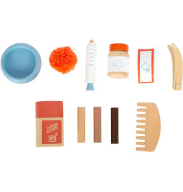 Katze mit Tasche und Pflege-Set