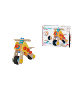 Holz-Dreirad-Bausatz neben Karton, auf dem Aufbauvarianten und Altersempfehlung abgebildet sind.