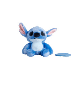 Blaues Plüsch-Alien mit großen Ohren und rundem Fleck rechts, vor weißem Hintergrund.