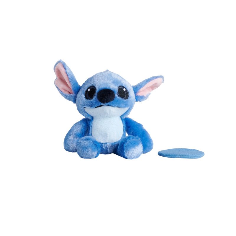 Blaues Plüsch-Alien mit großen Ohren und rundem Fleck rechts, vor weißem Hintergrund.