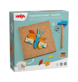 HABA Hammer-Spiel: Schachtel mit Korkplatte, bunten Formen, Karten, Nägeln und kleinem Holzhammer.