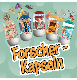 Fünf wissenschaftliche Kapseln und verschiedene Schätze über den fetten Schriftzug "Forscher-Kapseln".