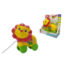 Gelber und roter Spielzeuglöwe auf grünen Rädern mit Zahlentasten, gezeigt innen und außen der Verpackung.