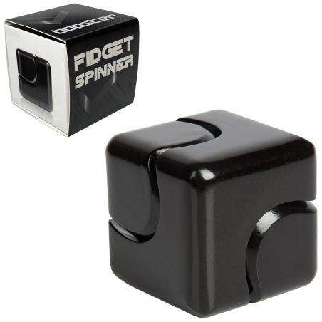 Ein schwarzer Fidget Cube liegt neben einer Box mit der Aufschrift "Fidget Spinner" in weißen Buchstaben.