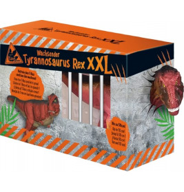 Orange Box mit Aufschrift Wachsende Tyrannosaurus Rex XXL und Dinosaurierspielzeug hinter Gittern sichtbar.