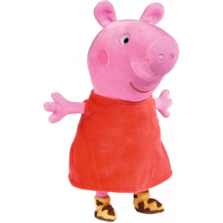 Plüschfigur eines rosa Schweins mit rotem Kleid und braunen Schuhen, steht mit ausgestreckten Armen.