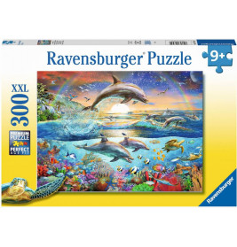 Puzzlebox mit springenden Delfinen, buntem Ozean, Fischen, Schildkröten und Sonnenuntergang. 300 Teile.