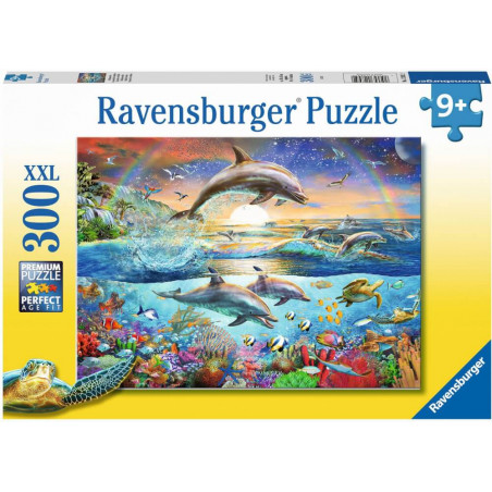 Puzzlebox mit springenden Delfinen, buntem Ozean, Fischen, Schildkröten und Sonnenuntergang. 300 Teile.