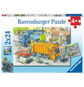 Ravensburger Puzzlebox mit Cartoonmotiv: Müllwagen und Arbeiter sammeln Abfall in einer Stadt.