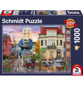 Puzzlebox mit nostalgischer Küstenstadt, Segelschiff, Oldtimern, Menschen und Tieren vor historischen Häusern.