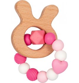 Beißring aus Holz in Hasenform mit rosa-weißem Perlenring, darunter Herz- und Strukturperlen.