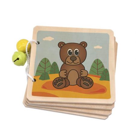 Holzbuch mit Comic-Bär auf dem Umschlag, zwei gelbe Glocken an weißer Schnur befestigt.