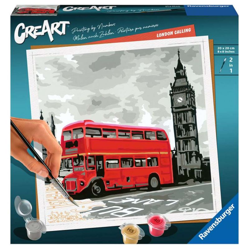 Eine Hand malt auf einem Malen-nach-Zahlen-Bild mit rotem London-Bus und Big Ben, betitelt London Calling. Eine Hand malt auf einem Malen-nach-Zahlen-Bild mit rotem London-Bus und Big Ben, betitelt London Calling.