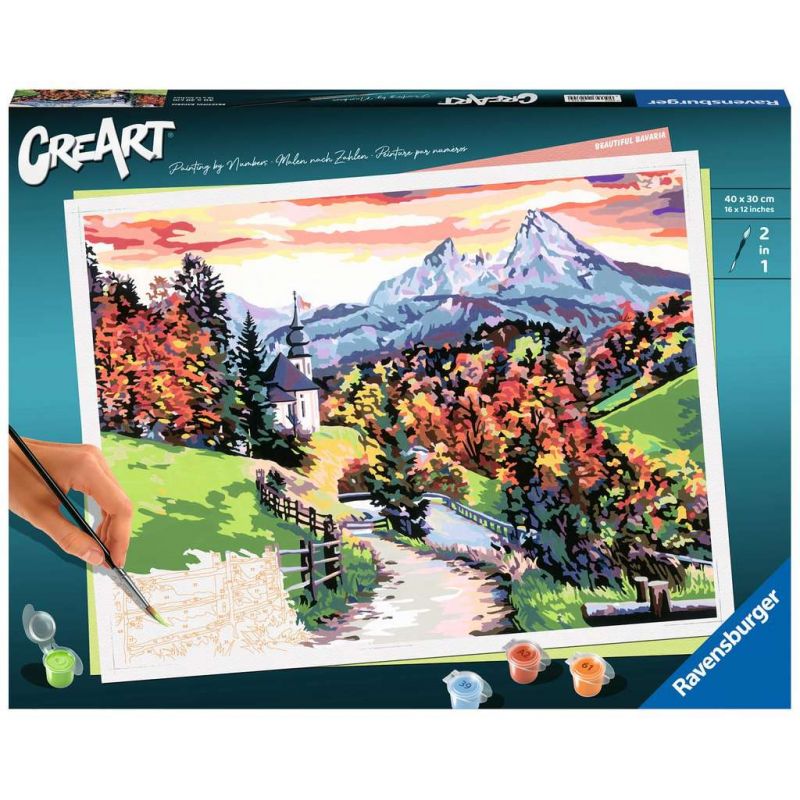 Eine Hand malt per Malen nach Zahlen eine bunte Herbstberglandschaft Farben und Pinsel liegen neben der Leinwand. Eine Hand malt per Malen nach Zahlen eine bunte Herbstberglandschaft Farben und Pinsel liegen neben der Leinwand.