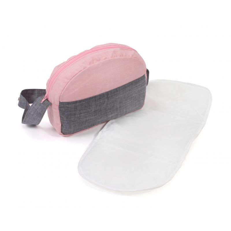 Rosa-graue Wickeltasche mit passender weißer Wickelunterlage, die daneben liegt.