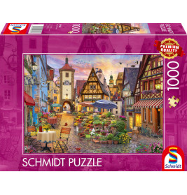 Schmidt Puzzle, 1000 Teile: Bunte Puzzlebox mit idyllischer europäischer Dorfstraße, Blumen und Cafés.