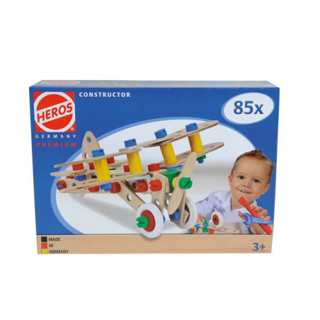 Box of Heros Holz-Konstruktionsset ab 3 Jahren mit Kind, das ein Flugzeugmodell zusammensetzt.