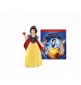 Schneewittchen-Figur mit Apfel steht vor einem Märchenbuch zu Schneewittchen und die sieben Zwerge.