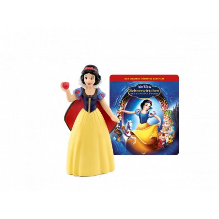 Schneewittchen-Figur mit Apfel steht vor einem Märchenbuch zu Schneewittchen und die sieben Zwerge.