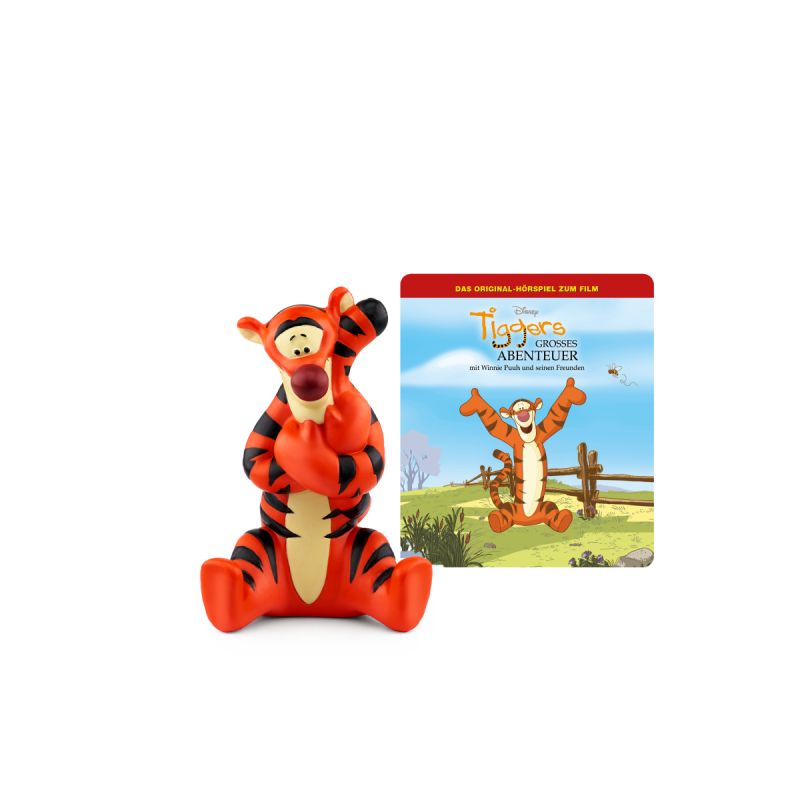 Tigger-Figur steht neben einer quadratischen Karte mit Tigger-Motiv vor blauem Himmel.