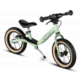 Hellgrünes Laufrad mit schwarzem Sitz, schwarzen Lenkern und cremefarbenen Reifen auf weißem Hintergrund.