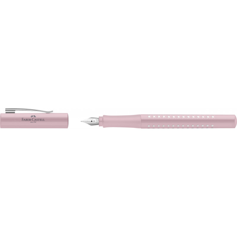 Ein rosa Faber-Castell-Füller mit abgenommener Kappe, der neben dem Stift liegt.