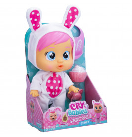 Eine Cry Babies Puppe mit pinken Haaren im weißen Hasenkostüm mit rosa Punkten, in ihrer Verpackung.