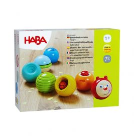HABA Raupen-Entdeckerbausteine ab 1 Jahr: Bunte, runde Steine und ein lächelndes Gesicht in der Box.