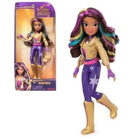 Modepuppe mit bunten Haaren, goldener Jacke, lila Hose und Stiefeln neben ihrer Verpackung.