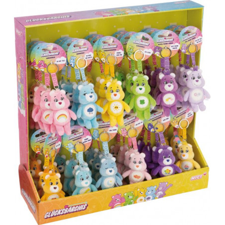 Display-Box mit kleinen, bunten Care Bears Plüsch-Schlüsselanhängern, sortiert nach Farbe und Charakter.