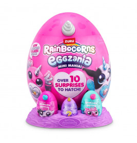 Ein pinkes Rainbocorns Eggzania Überei mit kleinen Überraschungseiern und bunten Tiermotiven auf lila Basis.