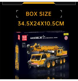 Schachtel mit gelbem Kran-Bausatz, Maße 34,5 x 24 x 10,5 cm.