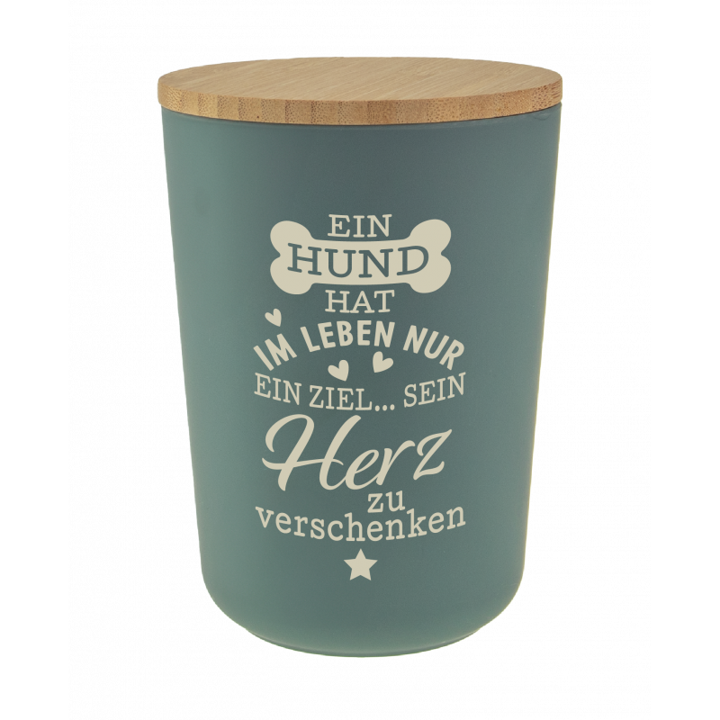 Grüner Behälter mit Holzdeckel und deutschem Text über einen Hund, der sein Herz verschenkt.