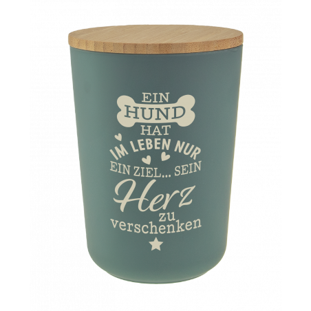 Grüner Behälter mit Holzdeckel und deutschem Text über einen Hund, der sein Herz verschenkt.