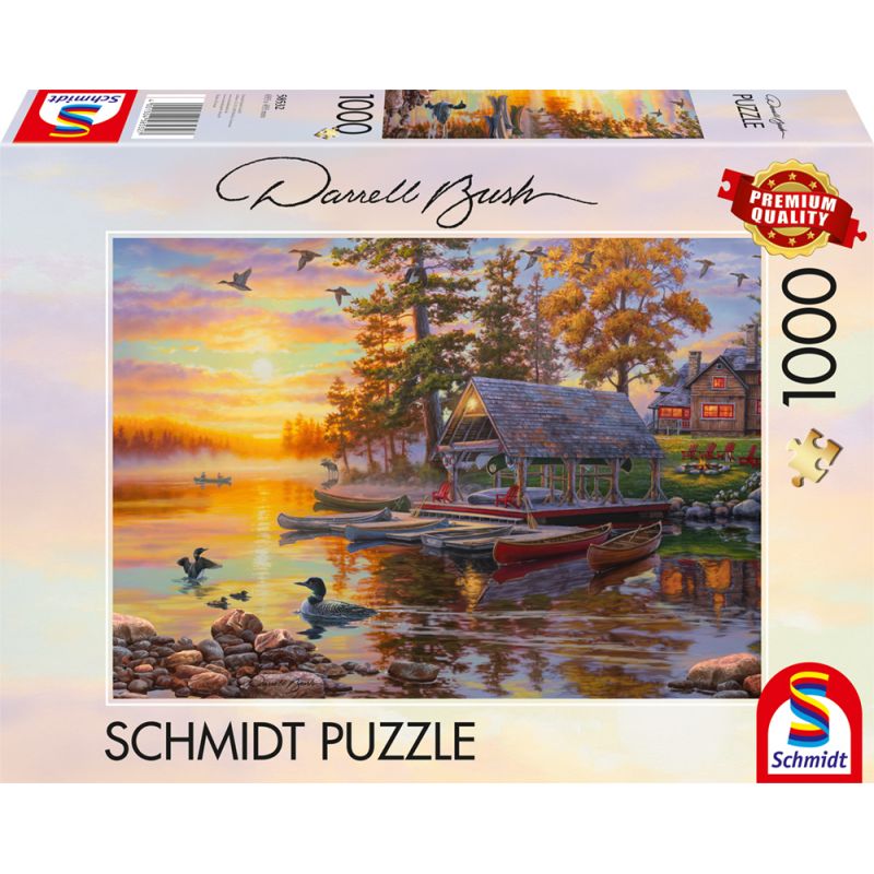 1000 Teile Schmidt Puzzle: Hütte am See mit Booten bei Sonnenuntergang, Motiv von Darrell Bush.