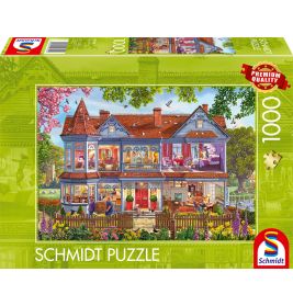 Schmidt Puzzle, 1000 Teile: Schachtel mit detailreicher Illustration eines viktorianischen Hauses und Gartens.