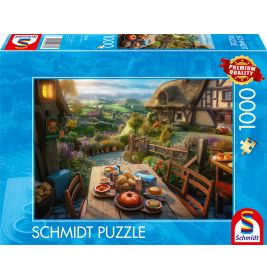 Gemütliche Frühstückstafel im Freien in einem Dorf, abgebildet auf einer 1000-teiligen Schmidt Puzzle-Schachtel.