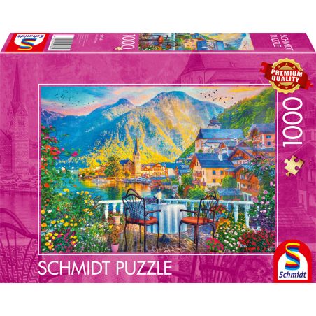 Schmidt Puzzle mit 1000 Teilen: Motiv zeigt malerisches Seedorf mit Bergen und Blumen.