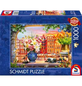 Schmidt-Puzzle mit 1000 Teilen: Motiv aus Blumenarrangement und bunter Häuser-Stadtansicht.